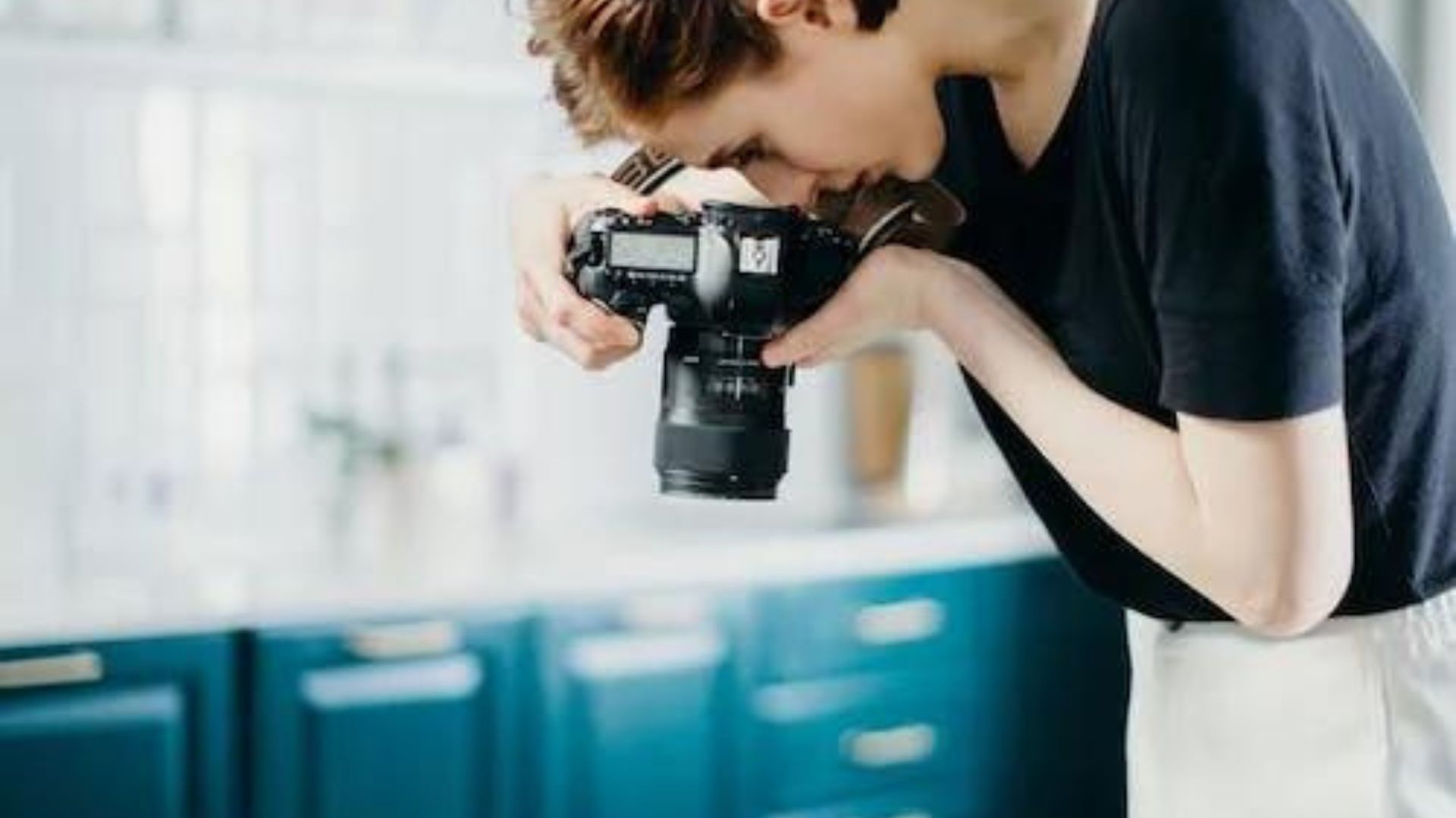 a young man capturing a photograph showing product photography