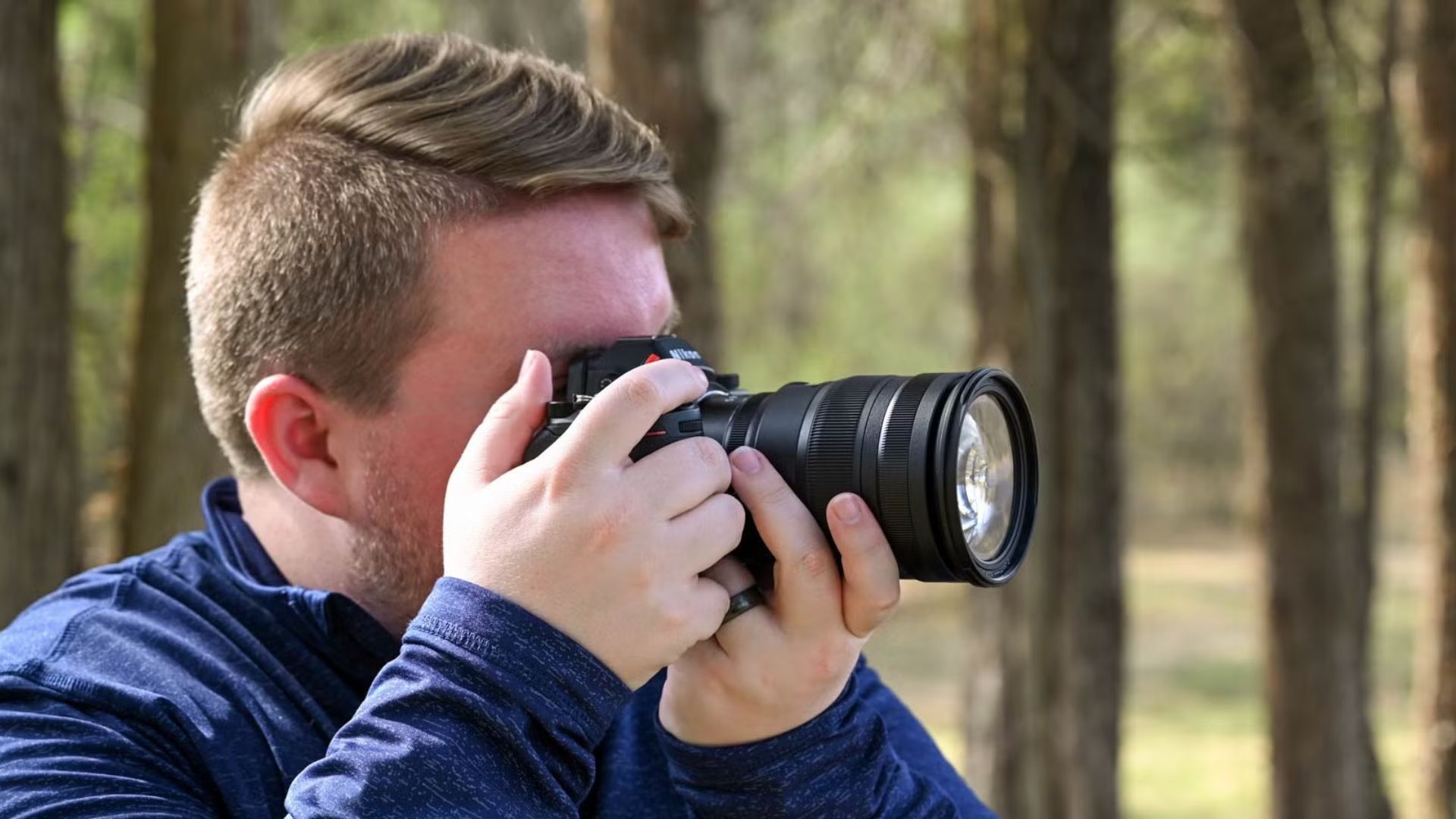 A Man Taking a Photograph Using One of the Best Cameras for Photography in 2024