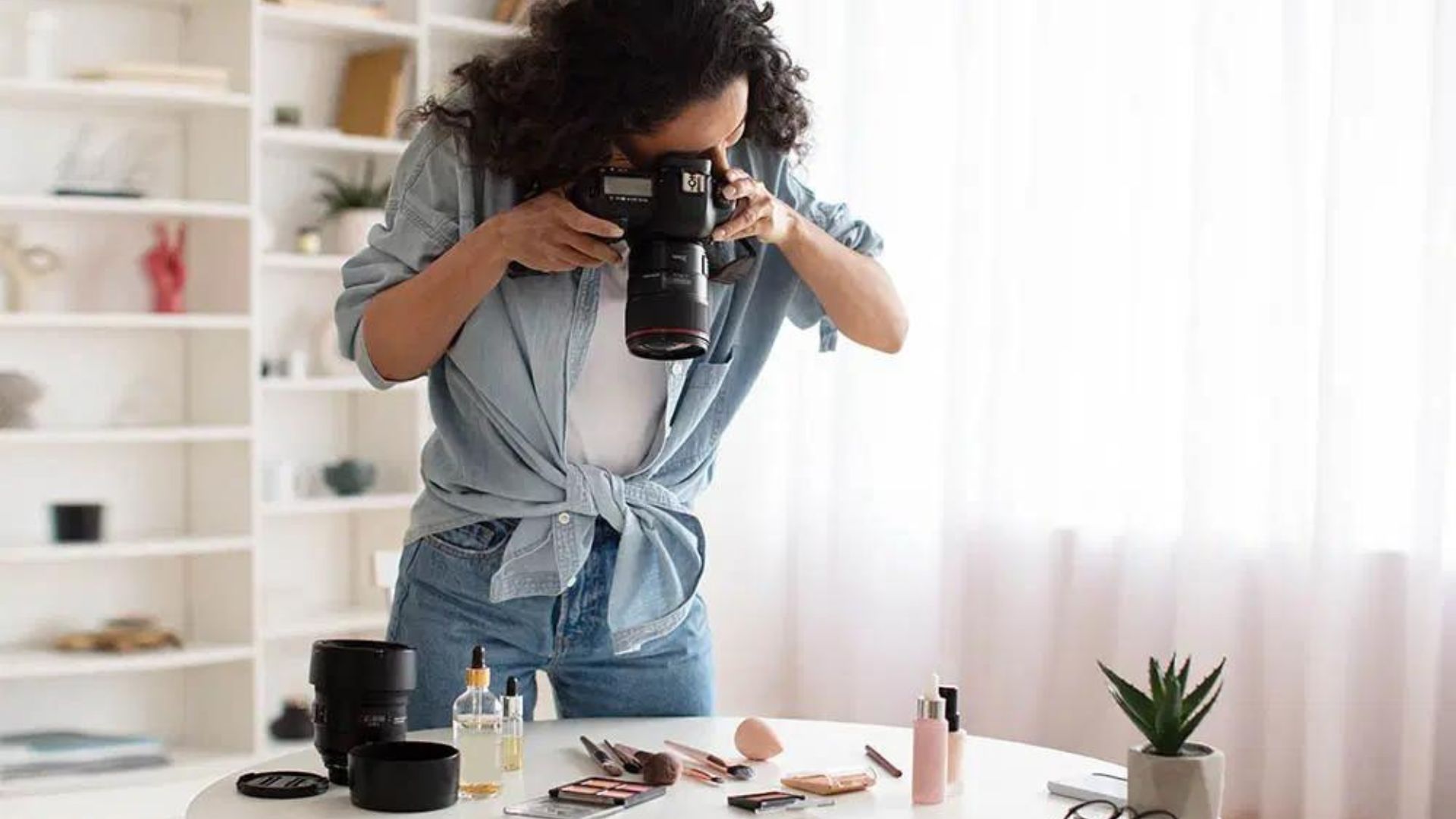 A Lady Taking a Photography Of the Products Showing Why is Commercial Photography Important for Your Brand